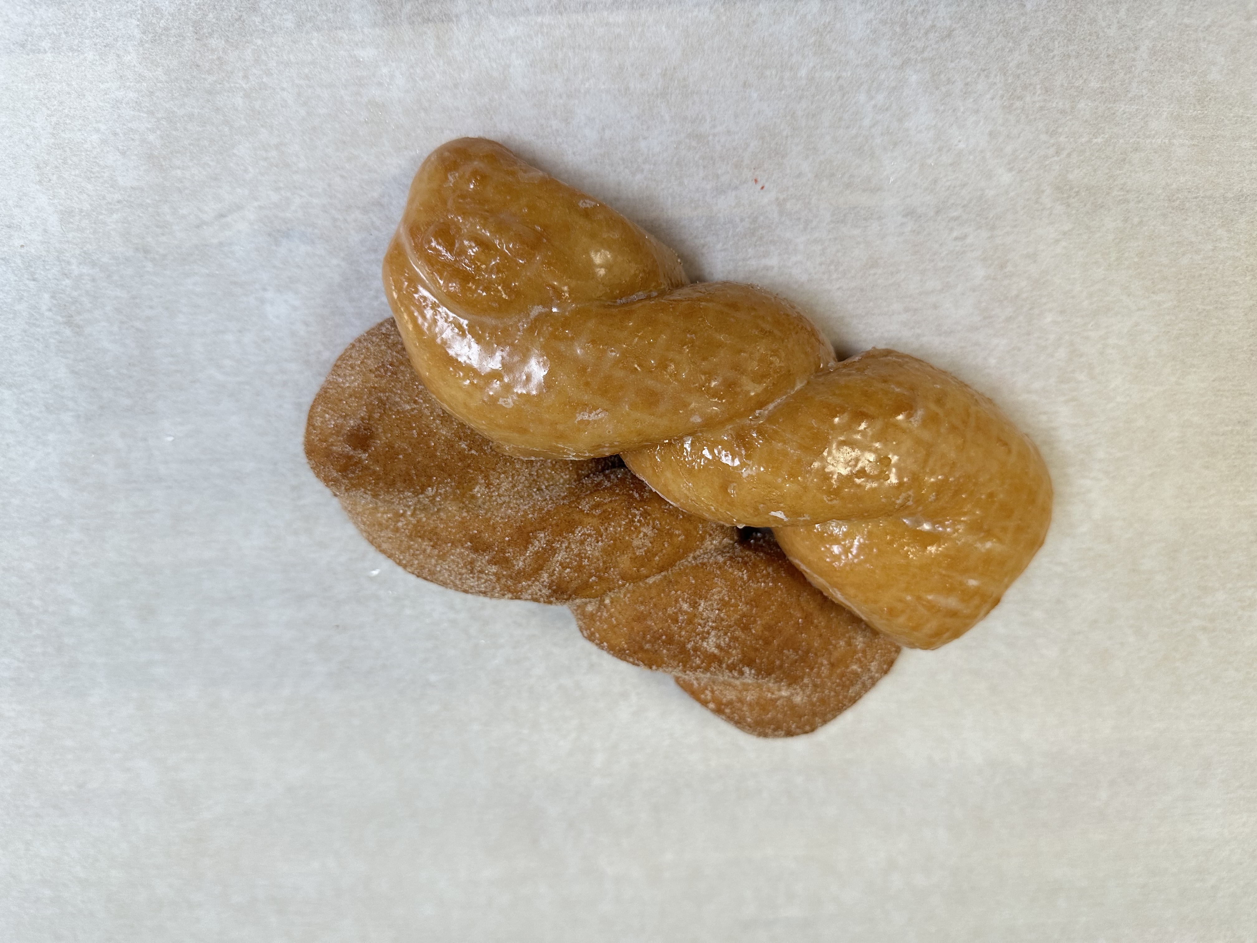 Delicious twisted pastries with sweet coating